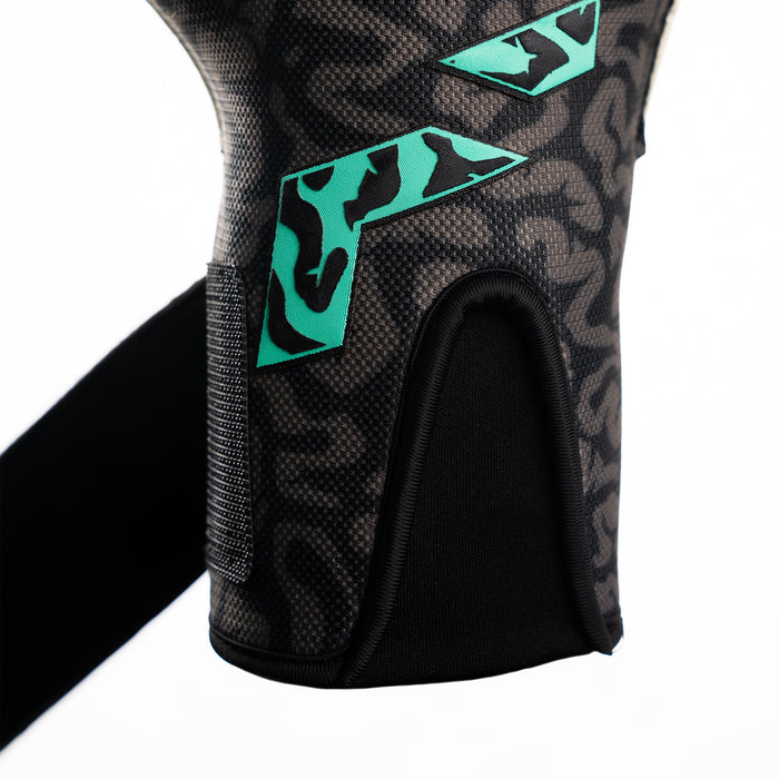 Close-up of the Speed Sleeve entry and latex wrist strap on the OG1 Mentality Monster